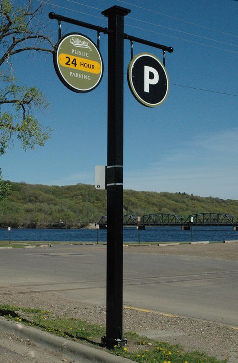 I like the simple arm of this parking sign. Could be added to any existing light pole. Pole Signage, Street Branding, Church Exterior, Signage Systems, Direction Signs, Coffee Process, Pole Sign, Signage Ideas, Experiential Design