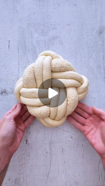 Idan Chabasov AKA Challah Prince™ official on Instagram: "Get ready for Rosh Hashanah with a Round Challah! I'm thrilled to share my first round challah tutorial for the upcoming High Holidays! This challah is perfect for your Rosh Hashanah table, symbolizing the endless cycle of life and new beginnings. Watch the full video to see the braiding process, and save your spot—Rosh Hashanah is just around the corner!  🍞Recipe for this beautiful round challah: 330g water 10g dry yeast 75g sugar 15g salt 75g olive oil 750g flour  ⚖️Dough Division Instructions: Divide the dough into 9 strands in total: 8 strands for the main braid and 1 strand coated with sesame for decoration.  8 strands, each weighing 120g, should be rolled to a length of 20 inches or 50 cm. The sesame-coated strand should weig Round Challah For Rosh Hashana, Rosh Hashana Challah, Challah Braiding Tutorials, Round Challah Braiding, How To Make Challah Bread, Rosh Hashanah Table Decorations, Rosh Hashana Decorations, Braiding Tips, Challah Rolls