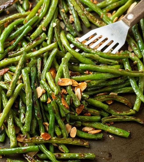 Oven Roasted Green Beans make a great side dish recipe that's easy to make with fresh or frozen green beans! Customize them by adding toppings such as almonds, garlic, bacon, lemon juice, Parmesan cheese, and more! Green Bean Recipes Lemon, Fireman Recipes, Pioneer Woman Green Beans, Amazon Tablet, Leftover Green Beans, Oven Roasted Green Beans, Green Beans Almondine, Blanching Green Beans, Beans On Toast