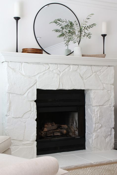 Black painted stone fireplace