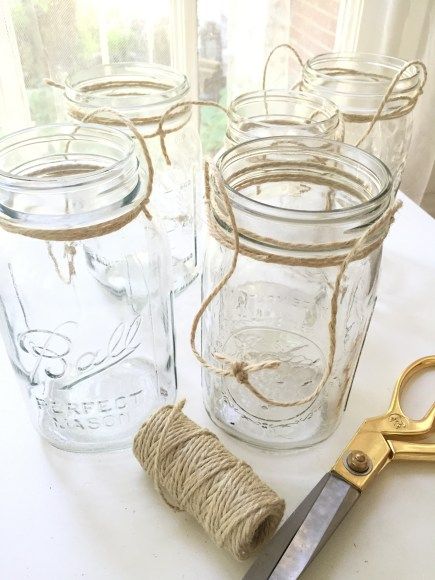 How To Tie Twine Around Mason Jar To Hang, Tying Twine Around Mason Jars To Hang, Hang Jars With Twine, Hanging Jars With Twine Diy, Hanging Jars With Twine, Mason Jar Hanging Candles, Mason Jars With Twine, Picnic Tablescape, Mason Jar Flower Arrangements