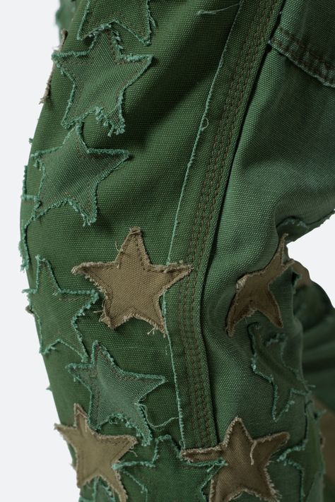 B451 Star Flare Denim - Olive | mnml | shop now Cute Sweatpants Designs, Raw Edge Embroidery, Upcycle Clothes Streetwear, Space Inspired Outfits Men, Rhinestone Clothing Designs, Painted Pants Design, Cool Pants Design, Unique Clothing Pieces, Patched Clothes