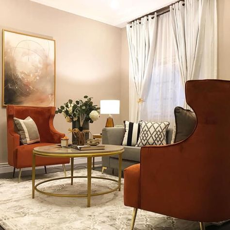 Accent Chairs and Gold Color Decor White Sofa Color Accent Chairs, Rust Armchair Living Rooms, Accent Chair With Grey Couch, Orange Accent Chair Living Room, Brown Chair Living Room, Grey Living Room With Color, Accent Chair Decor, Burnt Orange Living Room, Orange Accent Chair