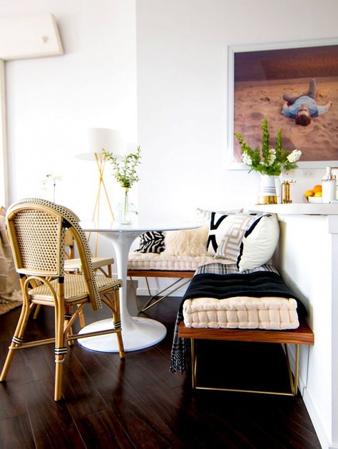 Nice combo of styles: midcentury bench, contemporary photograph, tulip table, and bistro chair.  Domaine Home tour: glam bohemian loft in Chicago. Breakfast Nook Table, Ruang Tv, Nook Table, Built In Seating, Kitchen Nook, Dining Nook, Breakfast Table, Decoration Inspiration, Small Dining