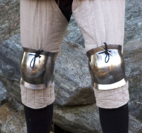 A component of Medieval and Renaissance armor that protected the knee. During the transition from mail armor to plate armor, this was among the earliest plate components to develop. They first appeared around 1230 and remained in use until 1650 when firearms made them obsolete. Knee Armor, Mail Armor, Andrew Loomis, Plate Armor, Armor Plate, Anime Monsters, Knight Armor, Arm Armor, Riding Boots