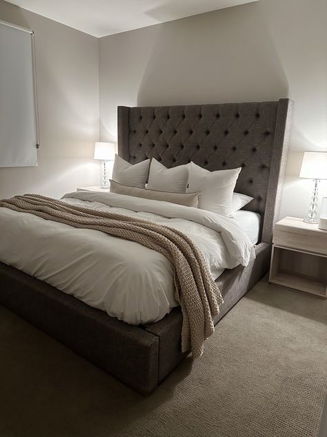 Dark Grey Bed Head Styling, Gray Backboard Bed, Bedding Ideas Dark Grey Headboard, Dark Grey And Neutral Bedroom, Bedroom Inspo Grey Headboard, Grey Fabric Bed Frame Room Ideas, Dark Grey Bedhead Styling, Grey Headboard Room Ideas, Dark Grey Bedframe Bedroom