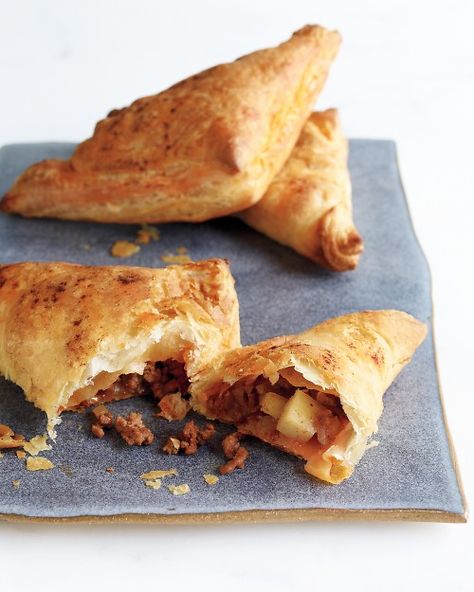 Beef and Potato Hand pies-made these for a week night dinner, served with a green salad, and sweet potato fries. Everyone liked them, except half didn't care for the addition of the golden raisins.    Also, it makes more than 8 pies worth. I have enough leftover filling to make omelettes for tomorrow morning's breakfast. Potato Hand Pies, Quick Beef Recipes, Phyllo Pastry, Beef Potatoes, Meat And Potatoes, Hand Pie Recipes, Beef And Potatoes, Phyllo Dough, Potato Pie