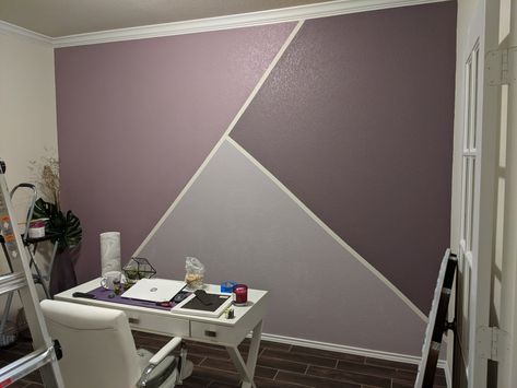 My geometric accent wall! 3 quarts of eggshell paint and some painters tape! [Light: behr, Standing Ovation] [Medium: behr, Fig Preserves] [Dark: behr, Classy Plum] Kids Accent Wall Purple, Light Purple Accent Wall Bedroom, Purple Accent Wall Office, Taped Wall Designs Painters, Purple Accent Wall Bedroom Kids, Geometric Wall Paint Purple, Dark Purple Accent Wall Bedroom, Purple Accent Wall Living Room, Purple Wall Painting Ideas Bedroom