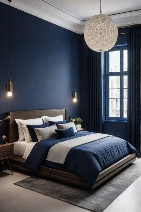 Modern bedroom with bold accent wall Dark Accent Wall, Bold Accent Wall, Moody Maximalist, Mobile Home Redo, Light Blue Throw Pillows, Bedroom Board, Dark Accent Walls, Navy Bedrooms, Dark Blue Paint