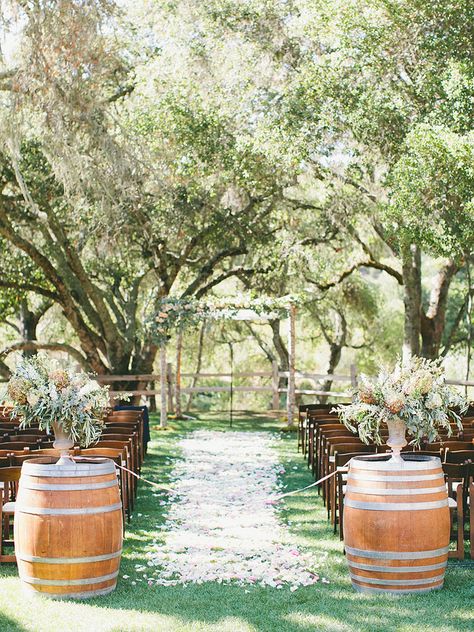 Usher the bride down a rustic wedding aisle with wooden wine barrels decked out in cascading florals or lush garlands. Fall Wedding Vineyard, Vineyard Wedding Decor, California Winery Wedding, Wooden Barrels, Vineyard Weddings, Equestrian Wedding, Rustic Italian, Wedding Ceremony Photos, Wedding Aisle Decorations