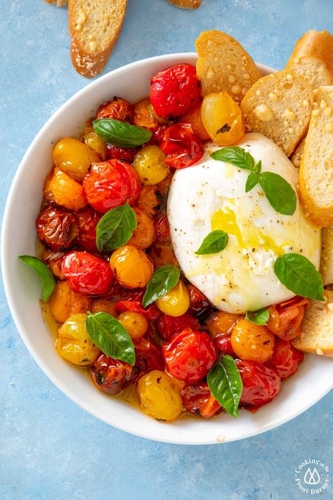 You'll love this easy to make Roasted Tomatoes and Burrata appetizer (or side dish). Made with juicy tomatoes that have been oven roasted with garlic and spices, creamy burrata cheese and topped with fresh basil. Grab some crusty bread for dipping and you are all set! #caprese #roastedtomatoes #burrata Burrata Appetizer, Tomatoes And Burrata, Tomatoes Burrata, Bread For Dipping, Oven Roasted Tomatoes, Baguette Bread, Parmesan Crisps, Burrata Cheese, Summer Tomato