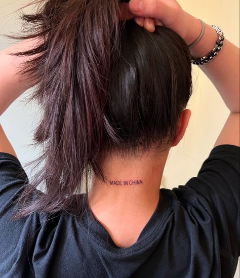 A tattoo on the back of a woman’s neck that reads “Made In China” Dylan Name Tattoo, Remi Tattoo Name, Good First Tattoos, Chinese Script, Small Neck Tattoos, Tattoo Script, Neck Tattoo, First Tattoo, Small Tattoos