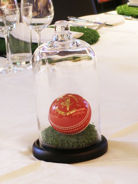 A Cricket Ball on a round of turf in a Cloche Cricket Centerpiece Ideas, Cricket Party Decorations, Cricket Theme Party, Cricket Theme Birthday, Cricket Party, Rugby Party, Sports Themed Wedding, Awesome Wedding Ideas, Tennis Birthday