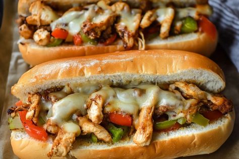 Oh boy, do I have a treat for you today! Let me take you on a mouth-watering journey with my favorite Chicken Philly Cheesesteak recipe. This sandwich holds not just a place in my stomach, but in my heart, too! I remember the first time I tasted a cheesesteak at a tiny deli downtown. The combination of juicy chicken, sautéed veggies, and melty cheese was more than just a meal; it was an experience! This Chicken Philly Cheesesteak is easy to whip up at home, and it brings that classic deli flav Taco Bell Quesarito Recipe, Chicken Philly Cheesesteak Recipe, Quesarito Recipe, Chicken Philly Cheesesteak, Philly Cheesesteak Recipe, Xmas Cookies Recipes, Veggies And Chicken, Chicken Philly, Sautéed Veggies