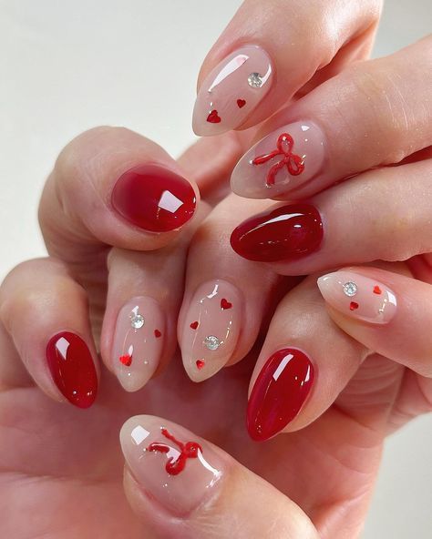 Get ready to shine this holiday season with these glamorous Christmas nail ideas! From glittery designs to elegant festive patterns, these nails will add a touch of sparkle to your celebrations. Perfect for any Christmas party or gathering! #christmasnails #holidaynailart #festivenails #sparklynails #xmasnails #glitternails #naildesignideas #holidaystyle #glamorousnails Christmas Nails Jewels, Short Almond Christmas Nails Winter, Cute Red Nails For Prom, Christmas Acrylics Red, Red Nail Designs Spring, Oval Shaped Christmas Nails, Jelly Christmas Nails, Christmas Nails With French Tip, Nails Red Design Ideas