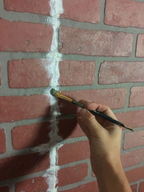 A couple hangs brick paneling in their living room, but then they do this! How To Hide Paneling Seams, Brick Wall Paneling Ideas, Painted Brick Paneling, Brick Paneling Ideas, Brick Veneer Panels, Diy Faux Brick Wall, Faux Brick Backsplash, Faux Brick Wall Panels, Faux Brick Wall