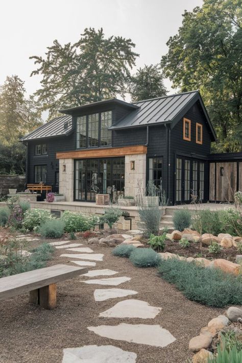 10 Black Modern Farmhouse Exteriors That Showcase Bold, Timeless Design - My Decor Inspo Remodel Front Of House Exterior Makeover, Dark Moody Farmhouse Exterior, Modern Farmhouse Big Windows, Industrial Farmhouse Outside, Modern Farmhouse Curb Appeal, Dark Gray And Black House Exterior, Modern Loft Exterior, Small Black House Exterior, Modern Farmhouse Outdoor Living