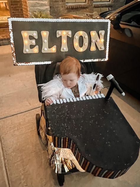 Coolest DIY Baby Elton John Rocket Man Stroller Costume Baby Stroller Costume, Elton John Halloween Costume, Diy Voodoo Doll Costume, Elton John Rocket Man, Stroller Costume, Elton John Costume, Voodoo Doll Costume, Wheelchair Costumes, Pregnancy Costumes