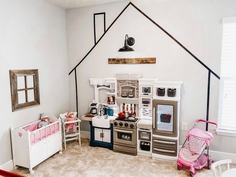 IG-@blissfully_the_bensons #playroom #playroomgoals #playroomideasonabudget #kidsplayhouseplans #pretendplay Home Corner Playroom, Role Play Playroom, Playroom Decal Ideas, Playroom Zones Play Areas, House On Wall Playroom, Pretend Town Playroom, Tiny Town Playroom, House Outline On Wall Playroom, Childminders Playroom