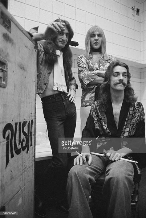 Canadian progressive rock group, Rush, backstage at the Civic Center in Springfield, Massachusetts, during the band's All The World's a Stage tour, 9th December 1976. Left to right: bassist Geddy Lee, guitarist Alex Lifeson and drummer Neil Peart. Rush Concert, Permanent Waves, Geddy Lee, Music Passion, Rush Band, Alex Lifeson, Music Of The Spheres, Jeff Jones, Neil Peart