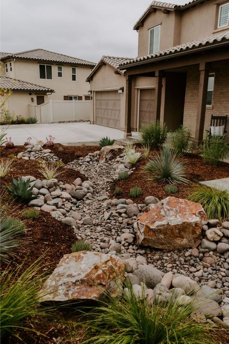 Dry Stream Beds are the perfect low maintenance landscape design. See the full yard transformation of our Río Sueño Project here!

River Rock Garden, Dry Riverbed Landscaping, River Rock Landscaping No Grass Yard, Dry Riverbed Landscaping, Low Maintenance Yard, River Rock Garden, River Rock Landscaping, Modern Front Yard, Small Front Yard Landscaping, Low Maintenance Landscaping, Rock Garden Landscaping