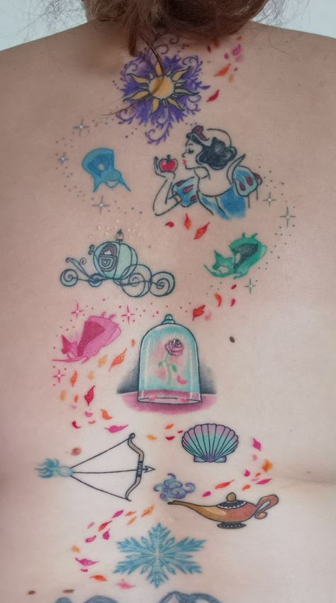 Princess Tattoo For Daughter, Disney Thigh Sleeve Tattoo, Feminine Disney Tattoo, Disney Princess Symbols Tattoo, Pretty Disney Tattoos, Disney Back Tattoos For Women, Disney Charm Tattoo, Disney Back Tattoo, Disney Spine Tattoo