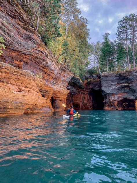 A sea kayaker on Lake Superior kayaking the Apostle Islands Sea Caves Sea Kayak, Isle Royale, Pictured Rocks, Michigan Road Trip, Apostle Islands, Isle Royale National Park, Minnesota Travel, Midwest Travel, Lake Trip