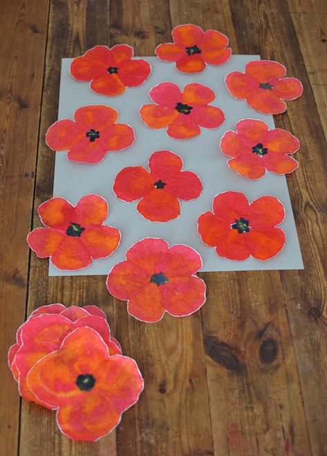 Children paint poppies using coffee filters and liquid watercolors. Poppy Art For Kindergarten, Flanders Field Art, Poppy Art Preschool, Poppy Art Grade 3, Grade 1 Poppy Art, Poppy Flower Art For Kids, Coffee Filter Poppy Flowers, Kindergarten Poppy Art, 3d Poppy Craft