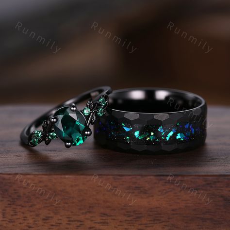 Here we have a Oval cut emerald couples ring set black gold matching promise ring His and Her wedding band Mens hammered tungsten ring anniversary gifts ITEM DESCRIPTION ✦ Handmade, high-quality item! ✦ Material: Sterling Silver/Solid Gold/Tungsten ►Sold as a two-piece set ►His ring is Black Tungsten Carbide with blue green opal. ►His band width: 8mm ►His tungsten ring will not turn green itself and will not cause your skin to turn green.  ✦ Durable - Incredibly Scratch-Resistant to always look Engagement Rings Men And Women, Ring Sets Wedding His And Hers, Wedding Rings Sets His And Hers Black, Black Matching Wedding Rings, Cool Wedding Rings For Men, Green And Black Wedding Ring, Magical Wedding Rings, Men Wedding Bands Black, Alt Wedding Rings