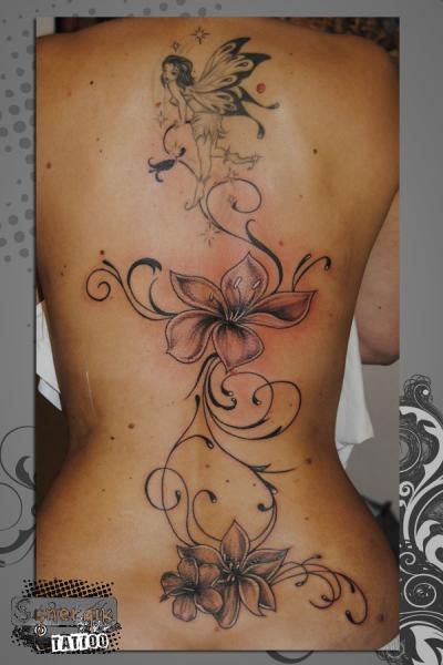 Feminine Back Tattoos Spine Flowers, Lilies Back Tattoo, Flower Cover Up Tattoos, Feminine Back Tattoos, Floral Back Tattoos, Fairy Tattoo Designs, Spine Tattoos For Women, Tattoos For Black Skin, Pretty Tattoos For Women