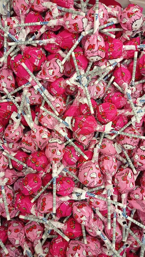 A bin of pink hello kitty lollipops strawbery flavored Pink Lollies, Hello Kitty Lollipop, Hello Kitty Confetti, Lollipop Background, Pink Aesthetic Lollipop, Heart Shape Lollipop Aesthetic, Lolipop Pink Candy, Pink Lollipop, Party Hardy