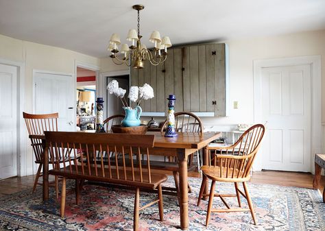 The family's dining room features Shaker-style seating and a well-loved rug. Built In Banquette, Wood Dining Room Table, Family Dining Rooms, Tata Harper, Vintage Dining Room, Large Dining Room, Mid Century Dining, Dining Nook, Colorful Rug