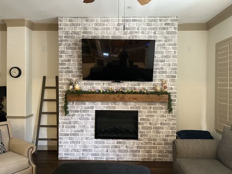 This was a super fun DIY project for us!  We were  not crazy about the entertainment stand we had, so after a lot of research and how to videos, we decided to create a brick wall with a fireplace, mantel and tv.
#fauxbrick #brickwall #DIYproject #electricfireplace #mantel #mantelmount Mantel Mount, Brick Fireplace Wall, Bedroom Tv Wall, Simple Ceiling, Stone Look Wall, Simple Ceiling Design, Balcony Bedroom, Fireplace Tv Wall, Entertainment Stand