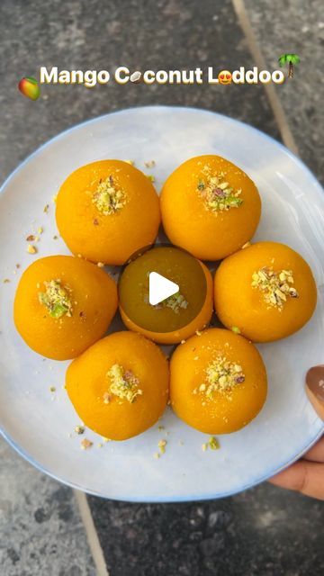 Diya Shah| Ahmedabad Food Blogger on Instagram: "Must try: Mango Coconut Laddoos🥭🌴🥥

Year after year I would deny making mango cooconut laddoos because who does that? Someone who loves mango and coconut and wants to have the best of both worlds. Let me be honest - it turns out TOO GOOD!😍

How to?
✨ Blend 1 alphonso mango (without water or anything) to make almost 1/2 cup mango purée.
✨ Dry roast 1 cup of desiccated coconut on slow flame.
✨ Add mango purée and 1/4 cup condensed milk. Mix well and cook it on medium flame until it starts leaving the sides and comes to a bindable consistency.
✨ Make even sized laddoos, garnish with chopped pista (optional) and refrigerate it for at least 2 hours.

Serve these to the people you love and see them smile their hearts out.🥰

Share this with yo Coconut Ladoo Recipe, Recipes Mango, Alphonso Mango, Desiccated Coconut, Mango Puree, Coconut Almond, Mango Coconut, Indian Desserts, Condensed Milk