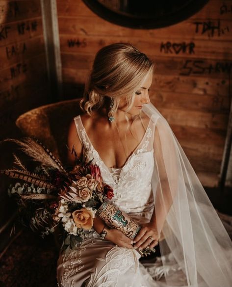 Western Wedding Bouquets With Feathers, Western Wedding Details Photography, Maroon Western Wedding, Western Wedding Detail Shots, Western Wedding Photography, Tooled Leather Wedding, Western Wedding Photos, Bridal Bouquet Wrap, Western Style Wedding