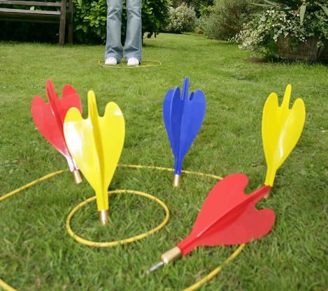 Lawn Darts: Also known as Jarts, Lawn Darts are possibly the most famous toys to be banned, and justly so. It's been determined they were responsible for sending over 6000 people to the hospital for injuries, most of them kids, many of them disabled for life. By the end, Jarts had killed three children and put one 11-year-old girl into a coma. Lawn Darts, Giant Garden, Throwing Games, Bbq Games, Blue Dart, Darts Game, Pub Games, Dart Set, Garden Games