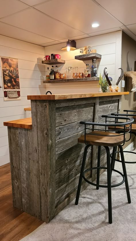 Rustic barnwood wet bar, shiplap walls, butcher block countertop, barnwood floating shelves Country Home Bar Ideas, Basement Wrap Around Bar Ideas, Reclaimed Wood Bar Ideas, Man Cave Garage Wall Shelves, Rustic Bar Basement, Kitchen Island Rustic Farmhouse, Wet Bar Counter, Butcher Block Countertops Bar, Cheap Basement Bar Ideas