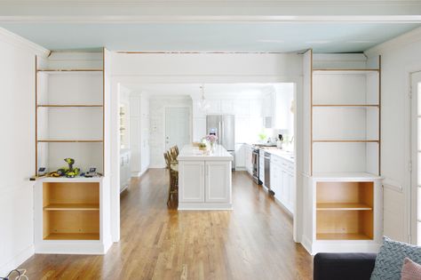 Young House Love | Adding Built-In Bookshelves Around Our Living Room Doorway | https://www.younghouselove.com Doorway Built Ins, Built In Room Divider Half Walls, Built In Bookshelves Doorway, Partial Wall Built Ins, Cabinets Around Doorway, Bookcases Around Doorway, Bookcase Doorway, Small Basement Remodeling, Living Room Door