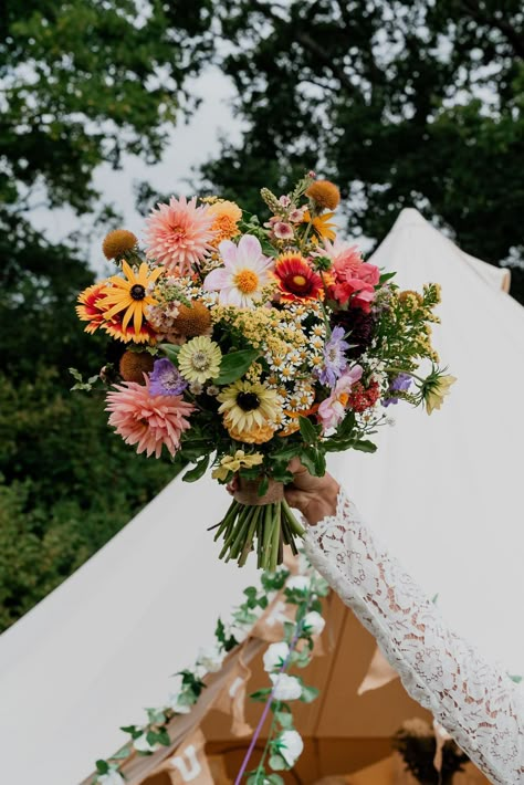 A bright joyful wedding bouquet full of colourful seasonal British grown September flowers. Perfect for a relaxed festival style wedding! Designed and created by @bryonymaeflowers Photography by @LaurenBethPhotography Please click on photo to see more. #festivalwedding #brightweddingbouquet #britishflowers #colourfulwedding #sussexflorist Wildflower Style Wedding Bouquet, Wild Flower Backyard Wedding, Multicolour Wedding Flowers, Fresh Wildflower Bouquet, Wedding Colourful Flowers, Bright Bridal Flowers, Bright Wedding Flowers Bouquet, Colourful Fall Wedding, British Summer Wedding