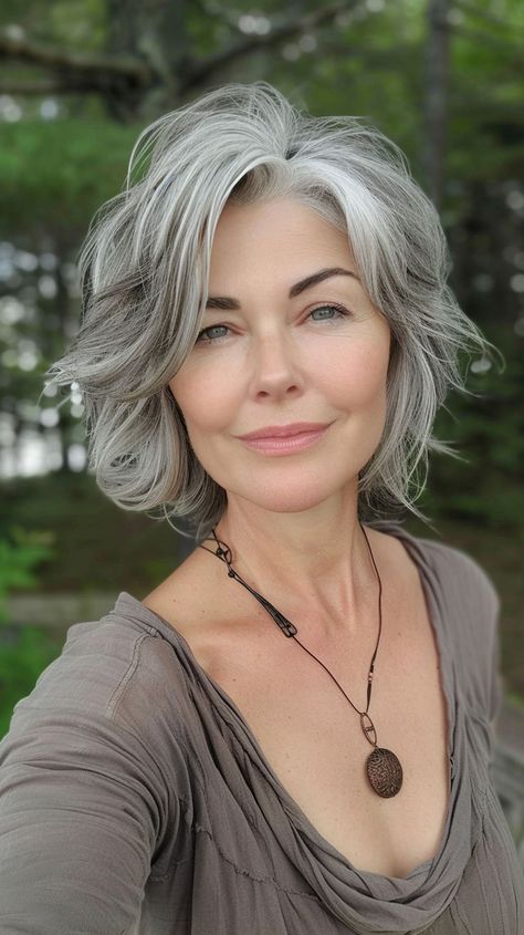 Embrace youthfulness with these 22 trendy medium-length layered haircuts. Fresh, fun, and full of life, these styles will add a playful vibe to your overall look. Grey Hair Transformation, Grey Hair Inspiration, Beautiful Gray Hair, Medium Length Hair With Layers, Gray Hair Cuts, Wavy Haircuts, Short Grey Hair, Short Wavy Hair, Haircuts For Medium Hair