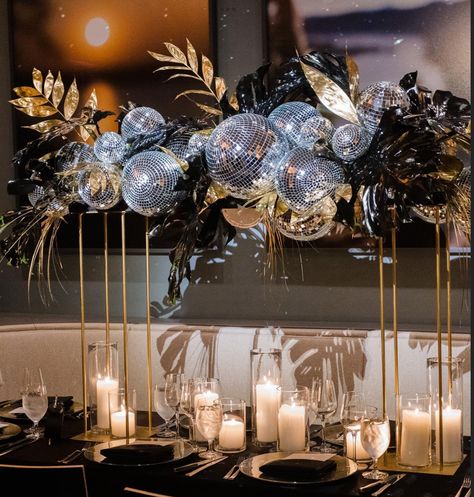 New Years Flowers, 1920s Centerpieces Roaring 20s, New Years Centerpieces, Luxury Party Decorations, Gold And Silver Disco Theme, Disco Tablescape, Gold Disco Ball Wedding, Disco Glam Party Decorations, Black Gold Silver Disco Party