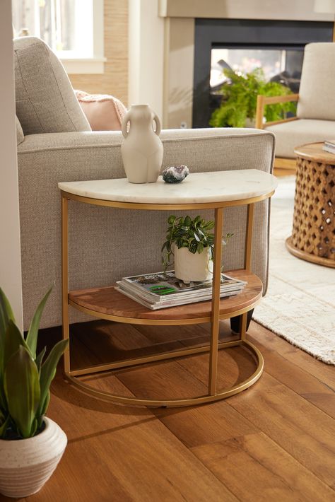 The elegant mixed-material Piper Half Circle Marble Top & Gold Metal Side Table brings two tiers of space-saving storage to any room, hallway, or entry. A chic three-tone accent table for organizing accessories and displaying decor, its versatile half-circular silhouette is perfect for placing flush against a wall or at the end of your sofa. #WorldMarket #EvanstonLiving #MarbleTable #HomeDecor #LivingRoomDecor #EndTable Half Circle Nightstand, Oval End Table, Unique End Tables Living Room, Gold Side Table Living Room, Round End Tables Living Room, Semicircle Table, Couch Side Table, Circular Side Table, Organizing Accessories