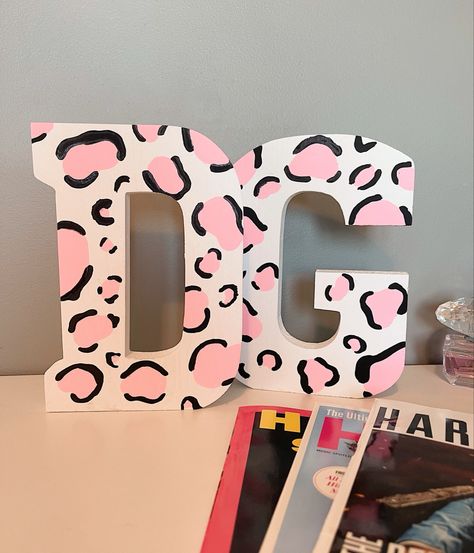 Pink Cheetah Painting, Cute Name Painting Ideas, Delta Gamma Paintings Canvases, Painted Letters Sorority, Pink Sorority Letters, Cheetah Print Painting, Sorority Wooden Letters, Painted Sorority Letters, Letter Painting Ideas Wooden