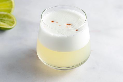 Mixing raw egg into drinks requires a lesson in safety. Explore the concerns of egg cocktails, how to safely work with them, and discover great recipes. Pisco Sour Recipe, Peruvian Drinks, Clover Club Cocktail, Gin Sour, Sour Foods, White Cocktails, Pisco Sour, Sour Cocktail, Eggnog Recipe