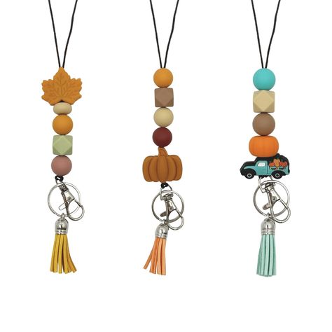 PRICES MAY VARY. Adorable and Unique Designs: Each lanyard features cute silicone beads in fall colors and delightful charms such as pumpkin, maple leaf, and farm truck. These designs are perfect for showcasing your personality and adding a cheerful vibe to your day. Premium Material: These fall teacher lanyards for ID badges are made with washable, durable silicone beads, sturdy cord, leather tassel, strong metal clip, and keyring. These cute breakaway lanyard include breakaway clasp for safety Teacher Lanyards, Lanyard Teacher, Fall Bead, Cute Teacher Gifts, Keychain Ideas, Beaded Lanyard, Teacher Lanyard, Teacher Assistant, School Supply Labels