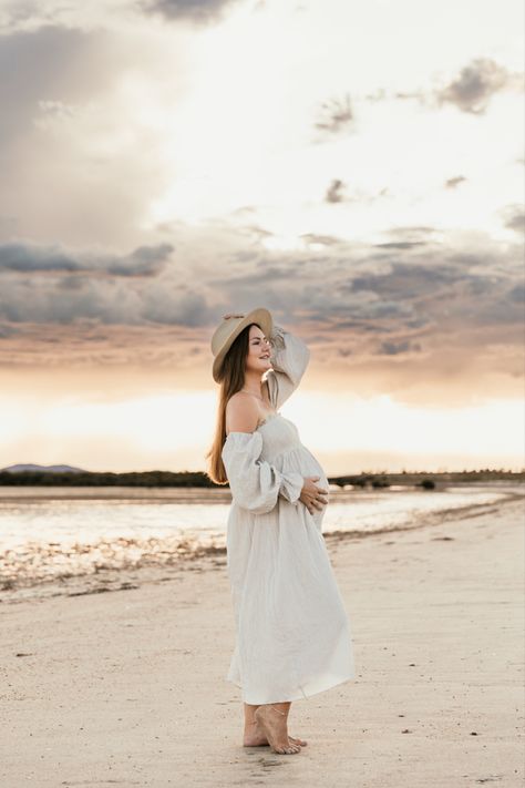 Expecting Mum posed on the beach with pretty pink cloudy skies Cloudy Maternity Photoshoot, Pregnancy Photoshoot Beach, Beach Maternity Photoshoot, Photoshoot Beach, Pink Skies, Beach Maternity, Maternity Photoshoot, Beach Photoshoot, Pink Sky