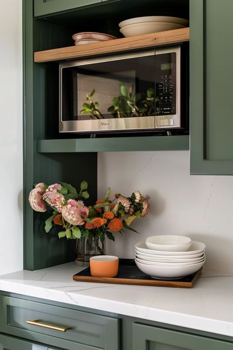 Transform your kitchen with stylish microwave wall shelf ideas that maximize space and reduce clutter. These creative designs allow you to keep your microwave off your countertops while adding a functional touch to your cooking area. Discover how a well-placed shelf not only frees up valuable counter space but also enhances the overall aesthetics of your kitchen. From minimalist wooden options to sleek metal designs, find inspiration to choose the perfect microwave shelf that complements your kitchen decor and fits your home style. Kitchen With Microwave Shelf, Microwave Rack Ideas, Wall Pantry With Microwave, Microwave Shelf Under Cabinet, Ideas Where To Put Microwave In Kitchen, How To Make A Microwave Look Nice, Microwave Small Kitchen Counter Space, Microwave On Open Shelving, Kitchen Microwave Over The Stove