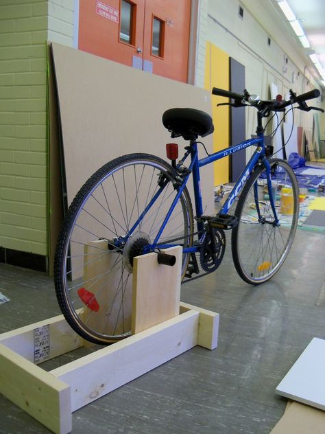 One of the projects featured in the health section of our exhibit is a homemade exercise bike. It's super simple and quick to make with an old bike and some wood. The only problem we have encounter... Diy Stationary Bike, Bike Stand Diy, Bike Diy, Stationary Bicycle, Indoor Bike Trainer, Best Exercise Bike, Bicycle Stand, Diy Stationary, Build A Bike