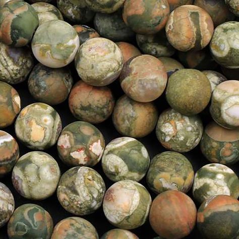 Shop natural rainforest jasper beads in 4mm, 6mm, 8mm, and 10mm. High-quality gemstones at the best wholesale prices! Rainforest jasper is a special kind of rhyolite lava found in volcanic areas all over the world. With its brown-green background with orange highlights, it resonates with an earthy feel. Quartz crystals are commonly found in the stone along with other minerals. Rainforest jasper is known for its subdued and subtle earth energy attracting, grounding and bringing pleasant energy Jasper Types, Earthy Crystals, Jasper Core, Rainforest Jasper, Orange Highlights, Spiritual Psychology, Earth Energy, Crystal Aesthetic, Green Jasper