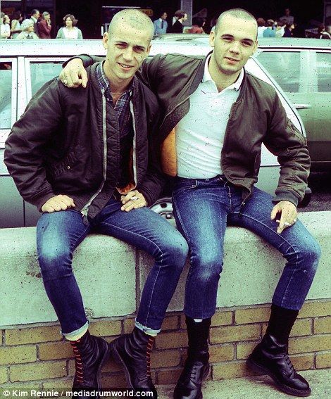 Skinheads pose for the camera.  Highly regionalised and excluded by society's moral norms, skinheads were tainted in the mid 1980s by tabloid hysteria of a fringe and violent far-right elements representing extreme nationalism Skinhead Tattoos, Skinhead Boots, Skinhead Fashion, Holiday Monday, Youth Subcultures, Bank Holiday Monday, The Rampage, Pose For The Camera, Dr Martens Boots